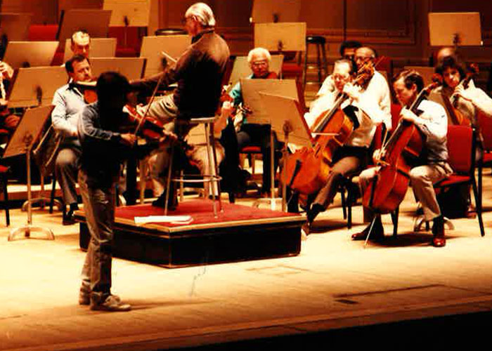 Archival photograph of young Richard performing with his violin