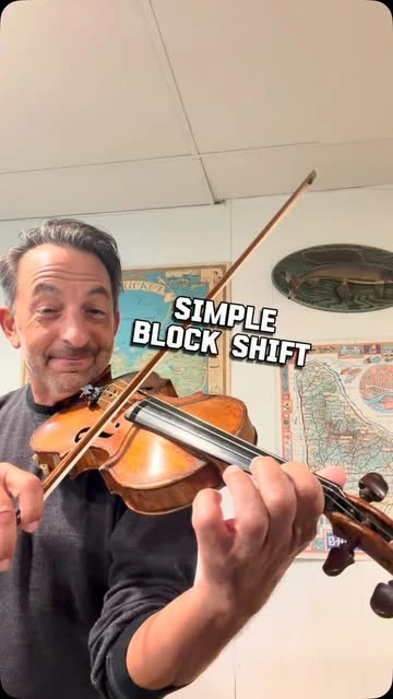 Richard playing violin in a lesson on a simple block shift